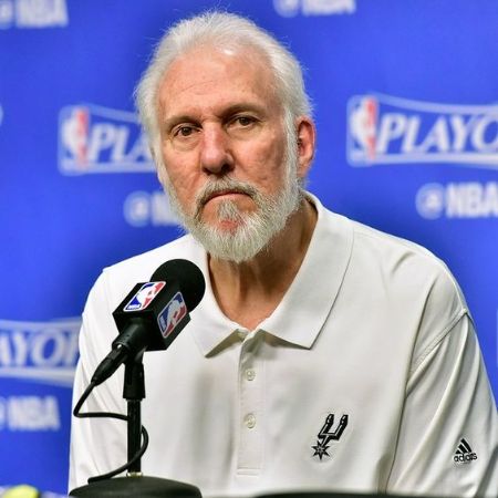 Micky Popovich's father Gregg Popovich at a press conference. 